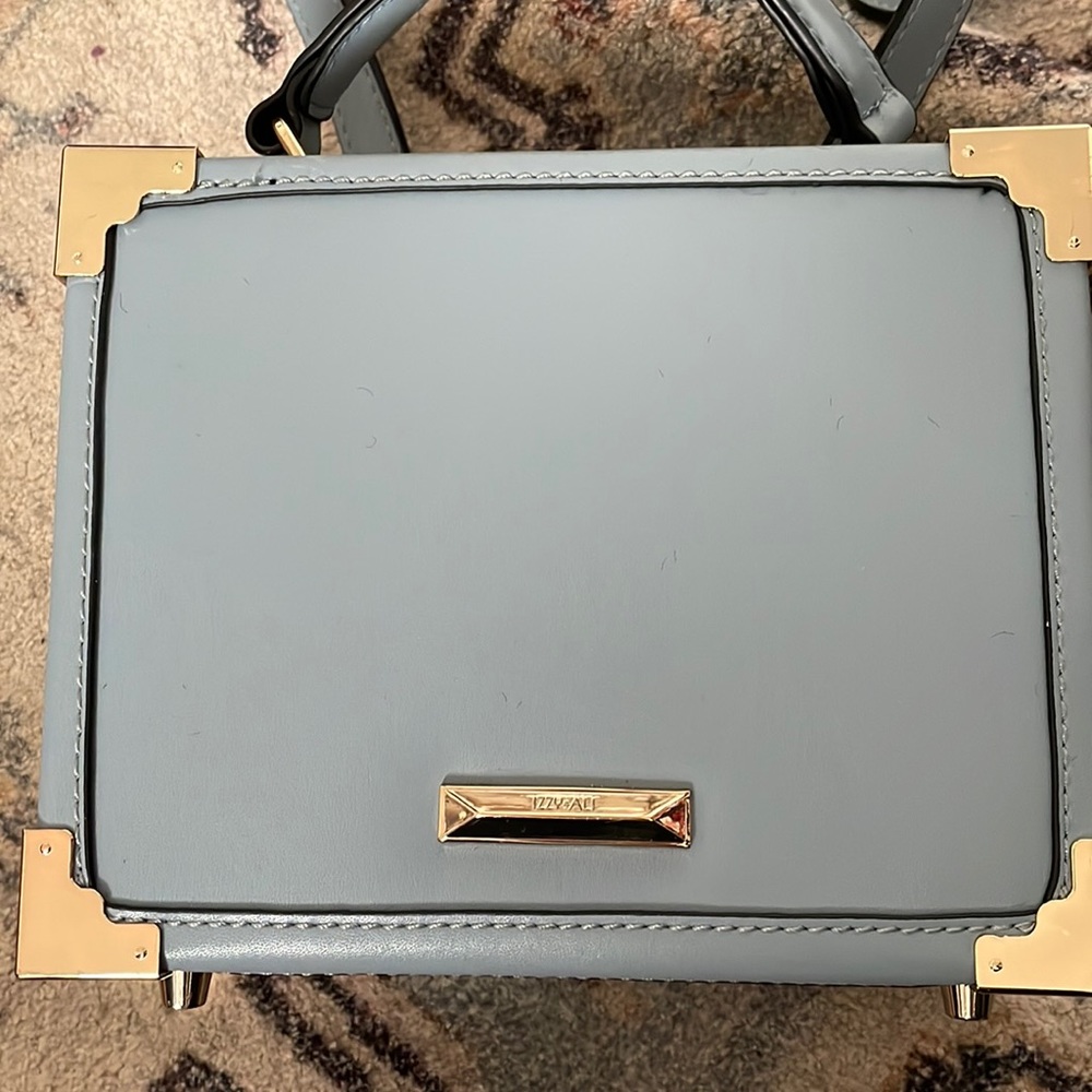Box bag with gold corners and lock adjustable strap and removable strap